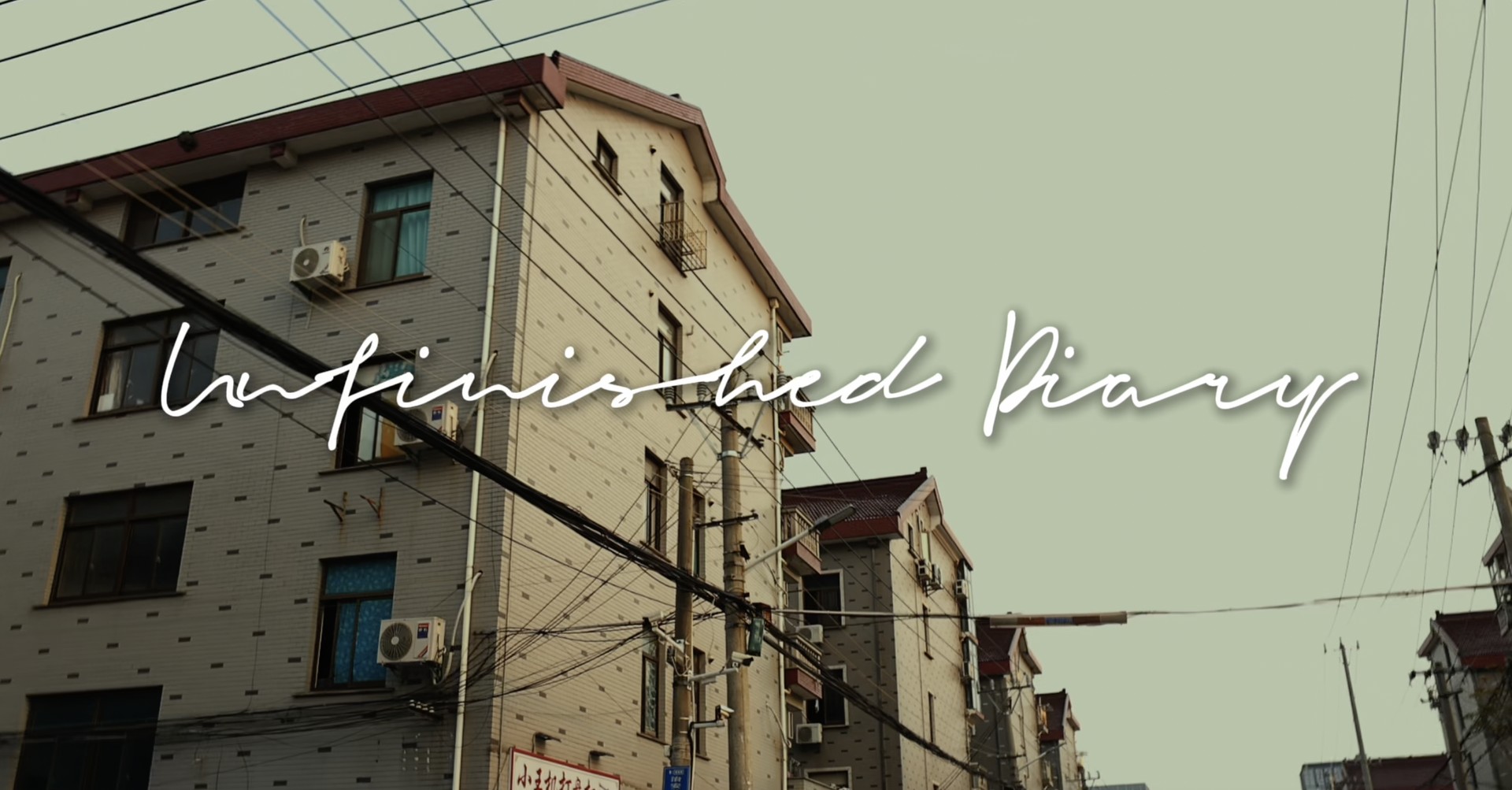 Unfinished Diary title over village buildings