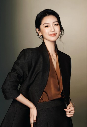 Woman in a black blazer, interview portrait reference